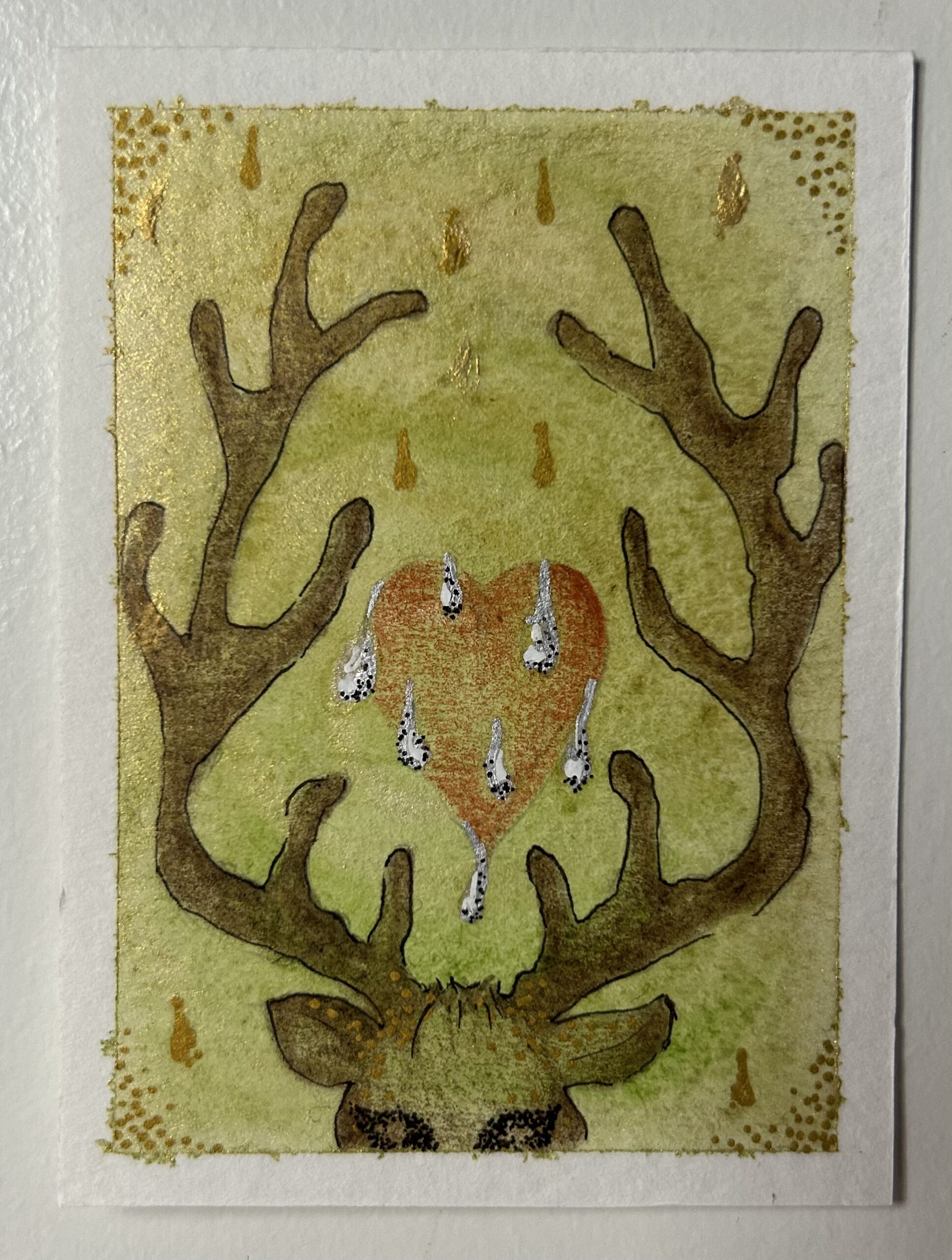 Original miniature painting “The Deer Maiden” by Nia Dannai, deer head with antlers, red heart with silver droplets on golden green spiral background, mixed media